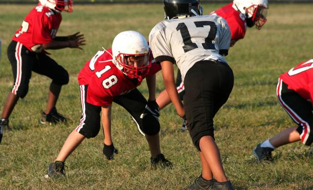 Fewer kids are playing tackle football, as about half of Americans say the sport is inappropriate for young people.