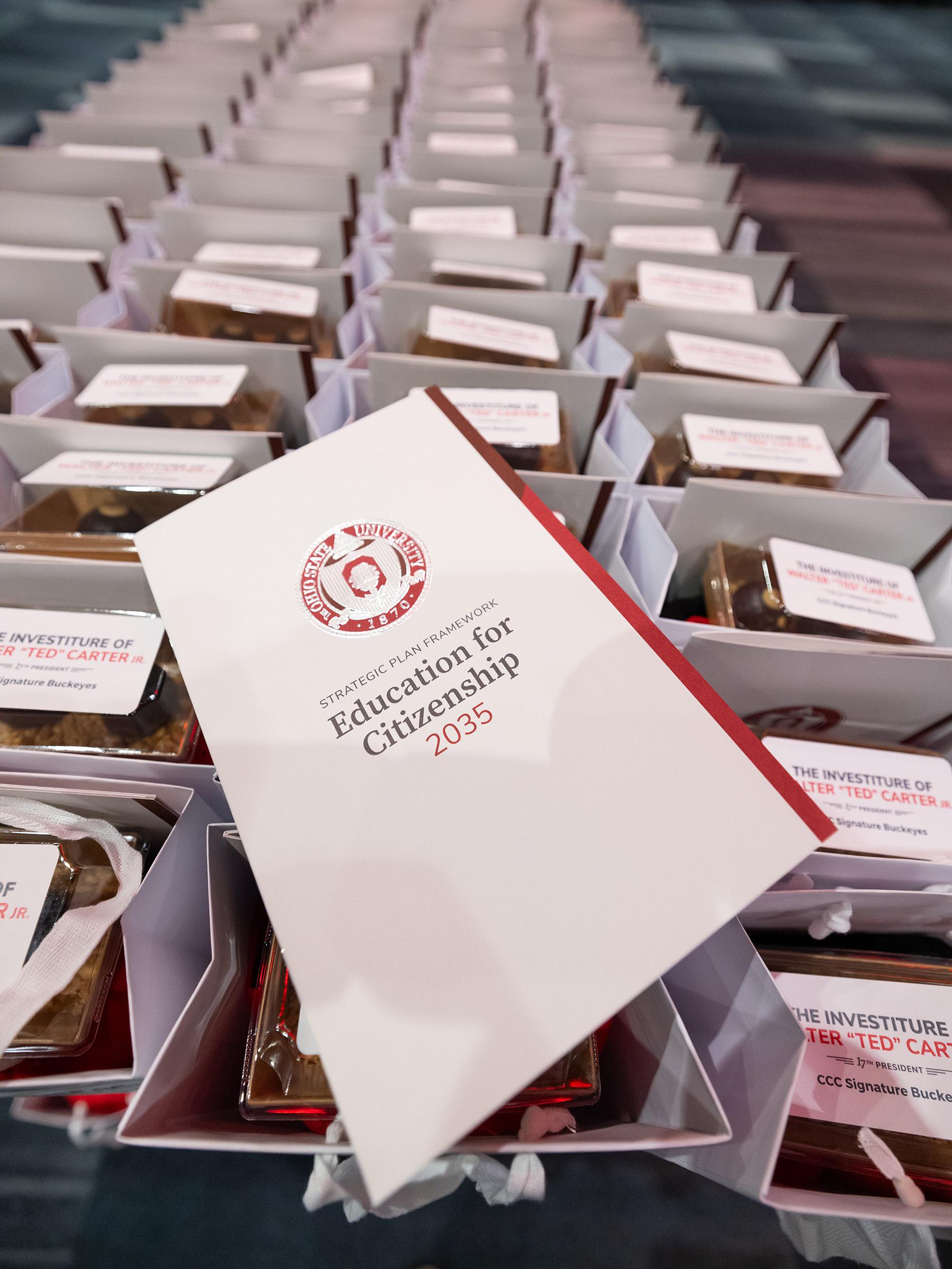Investiture booklet on top of gift bags