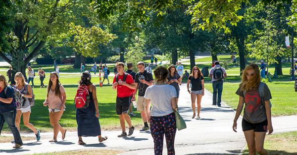 Students walking across the oval as they return to campus for fall semester