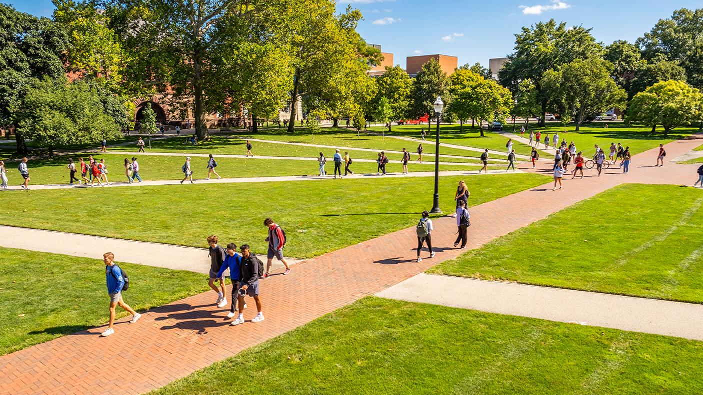 Students walk the paths of The Oval on the way to class during the fall semester.