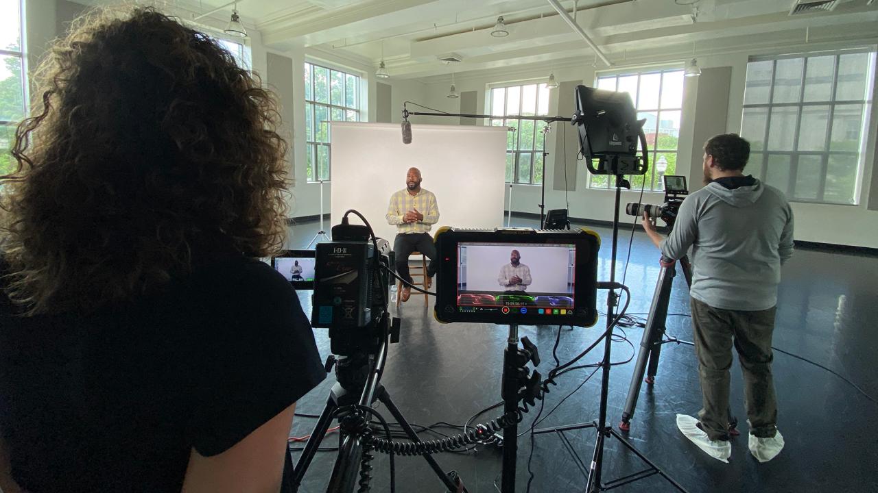 Staff members recording videography at Ohio State