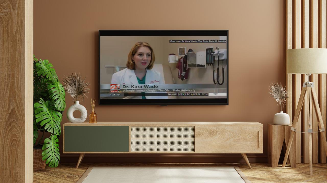 TV in updated neutral room showing news program